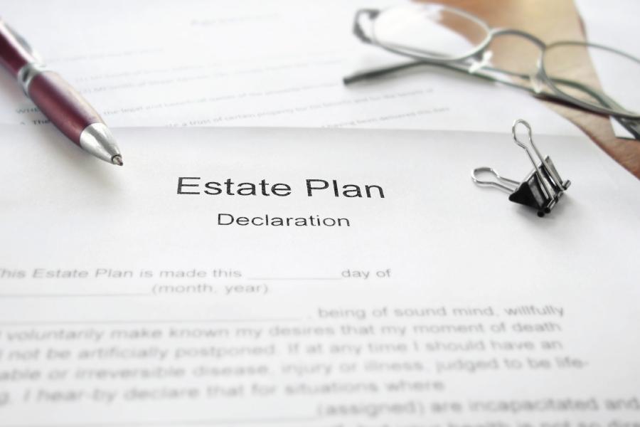 Documents on a desk that read, "estate plan"